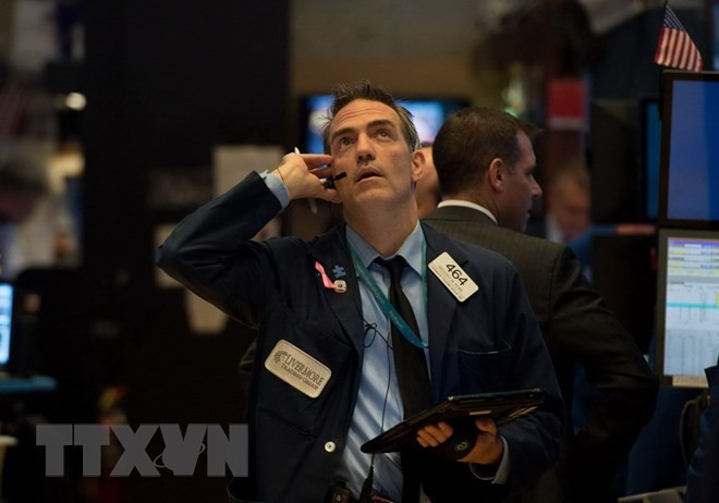 Giao dịch viên tại Sàn giao dịch chứng khoán New York, Mỹ. (Nguồn: AFP/TTXVN)