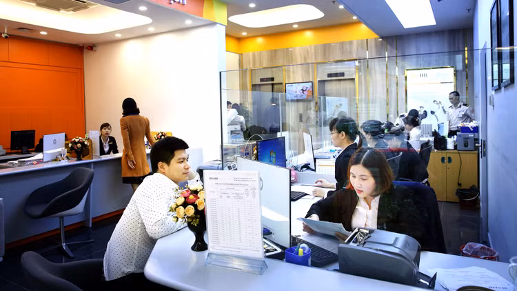 Đến cuối tháng 1/2019, tỷ lệ sử dụng vốn ngắn hạn cho vay trung, dài hạn của các ngân hàng thương mại nhà nước là 31,56%, của các ngân hàng thương mại cổ phần là 32,94%. Ảnh: Lê Tiên