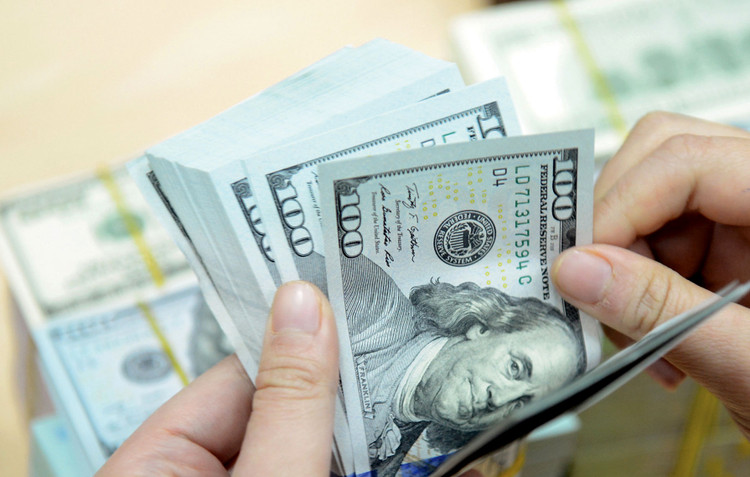Giữ ổn định tỷ giá là một trong những biện pháp để giảm rủi ro về dòng tiền đầu tư chảy ra khỏi Việt Nam. Ảnh: Hoài Anh