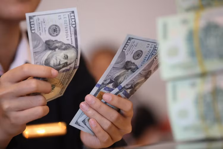 Các chính sách điều hành tiền tệ của Việt Nam hướng tới mục tiêu ổn định tỷ giá USD/VND nhằm tiếp tục thu hút dòng vốn đầu tư. Ảnh: Lê Tiên