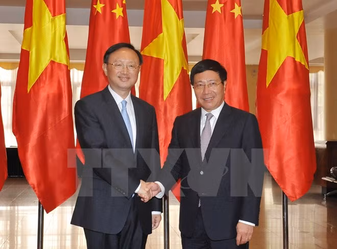 Phó Thủ tướng, Bộ trưởng Ngoại giao Phạm Bình Minh tiếp Ủy viên Quốc vụ Quốc Vụ viện Trung Quốc Dương Khiết Trì. (Ảnh: Nguyễn Khang/TTXVN)