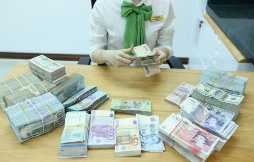 Tỷ giá USD hôm nay 15/6 tại Vietcombank giảm nhẹ. Ảnh minh họa: BNEWS/TTXVN