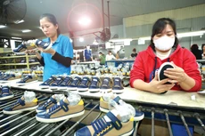 Để giữ vững mục tiêu CPI cả năm trong khoảng 4 - 4,5%, dòng chảy tín dụng cần tập trung vào xuất khẩu, sản xuất - lĩnh vực thiết yếu cho tăng trưởng GDP. Ảnh: Lê Tiên