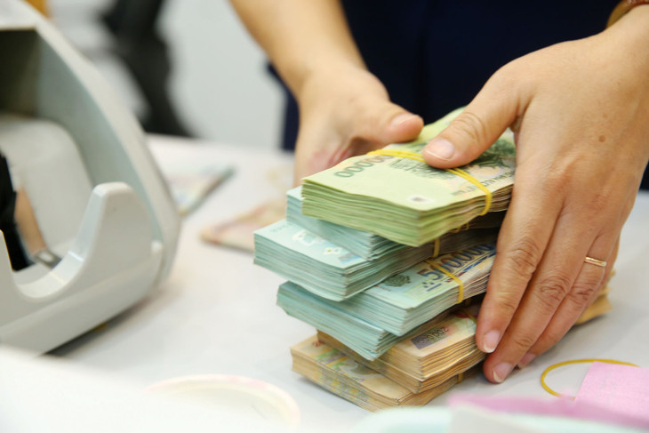 Ngân hàng Nhà nước xác định tổng nợ xấu nội bảng, nợ bán cho VAMC chưa xử lý và nợ tiềm ẩn thành nợ xấu của các tổ chức tín dụng đến cuối tháng 2/2023 ước chiếm 5% tổng dư nợ. Ảnh: Lê Tiên