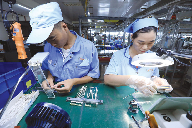 Giải quyết điểm nghẽn về thể chế, tạo lập môi trường đầu tư minh bạch là giải pháp quan trọng để duy trì niềm tin của nhà đầu tư nước ngoài. Ảnh: Tuấn Anh