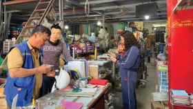 Cơ quan thuế sẽ triển khai đợt cao điểm 15 ngày hỗ trợ hộ kinh doanh đăng ký, kê khai và nộp thuế theo quy định mới. Ảnh: Tiên Giang