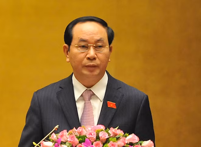 Chủ tịch nước Trần Đại Quang đọc tờ trình. Ảnh: Giang Huy