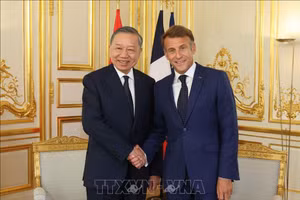 Tổng Bí thư, Chủ tịch nước Tô Lâm và Tổng thống Pháp Emmanuel Macron gặp hẹp - Ảnh: TTXVN