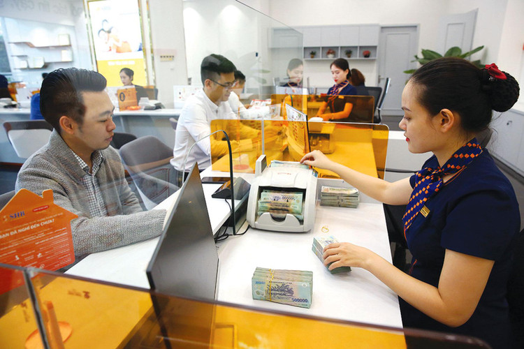 Mặt bằng lãi suất có xu hướng tăng nhẹ do nhu cầu tín dụng tăng cao nhằm đáp ứng quá trình phục hồi kinh tế. Ảnh: Lê Tiên