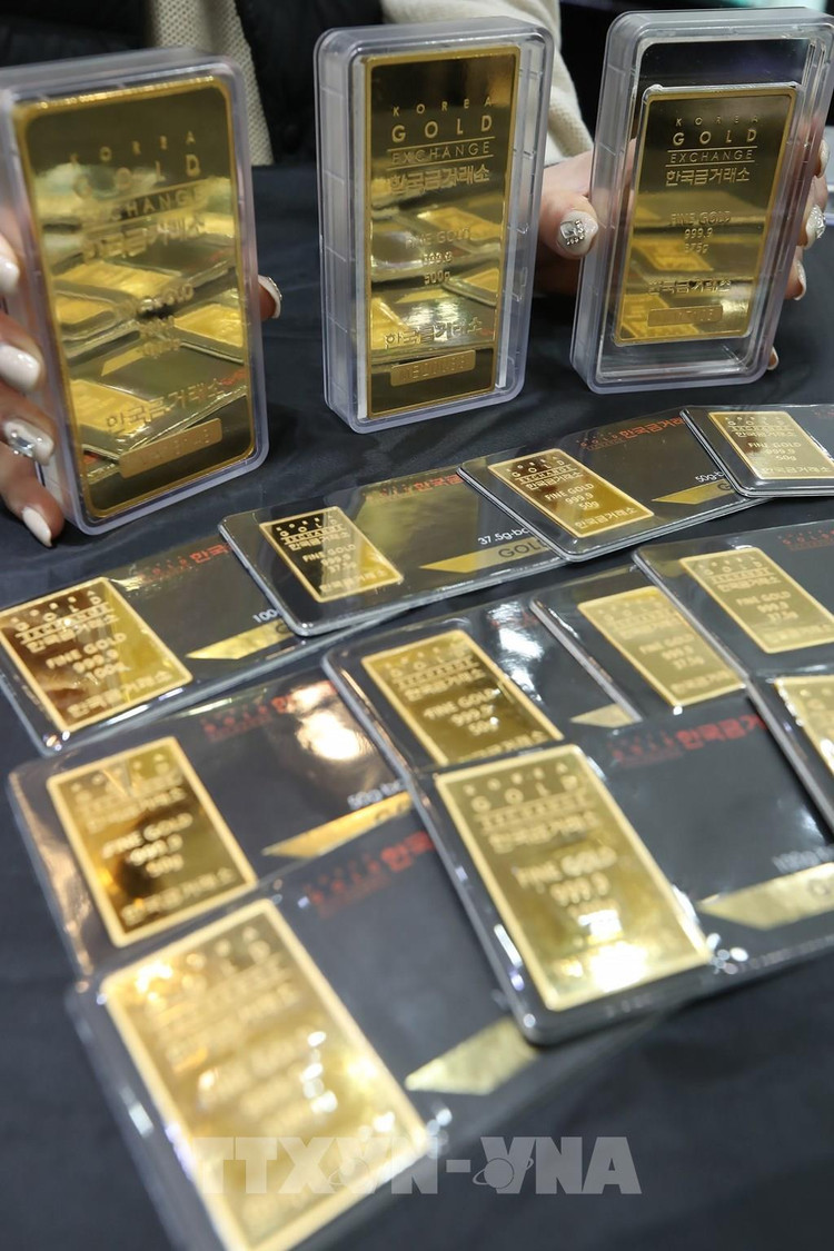Giá vàng thế giới lập đỉnh trong chín năm trong phiên 21/7. Ảnh: TTXVN phát