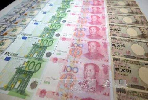 Giá đồng Nhân dân tệ tăng mạnh. Ảnh: Kyodo/TTXVN