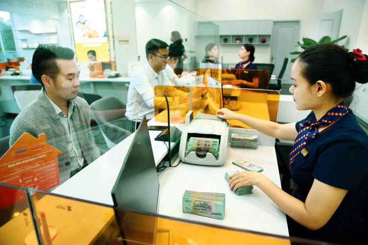 Việc điều hành lãi suất cần hài hòa lợi ích của người gửi tiền - người vay tiền và bảo đảm ổn định kinh tế vĩ mô. Ảnh: Lê Tiên