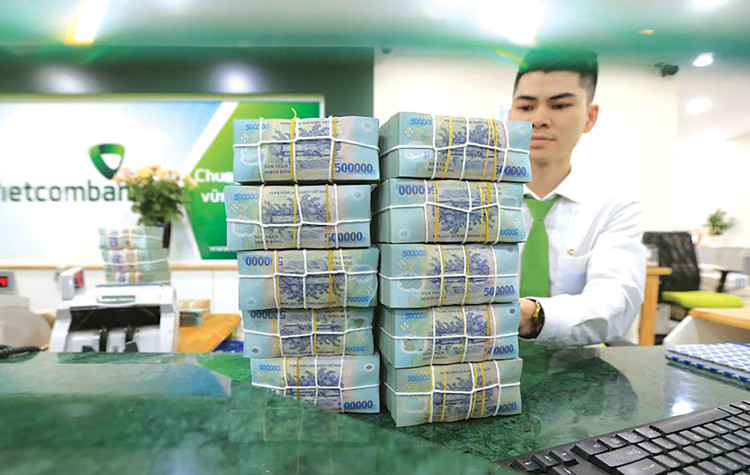 Ngân hàng Nhà nước chỉ đạo các tổ chức tín dụng hướng tín dụng vào những lĩnh vực sản xuất, kinh doanh, lĩnh vực ưu tiên theo chủ trương của Chính phủ. Ảnh: Minh Dũng