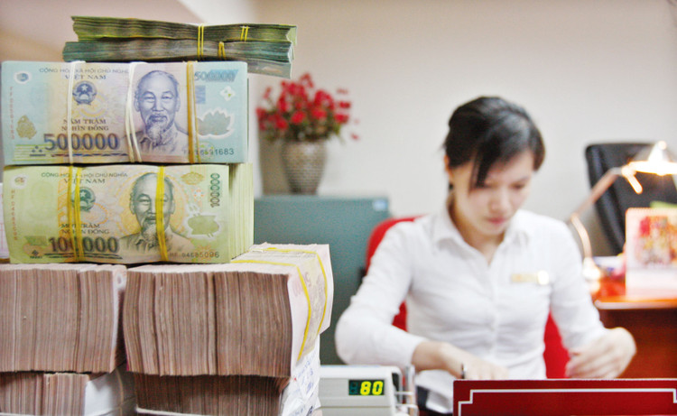 Đến cuối tháng 8/2023, tỷ lệ nợ xấu nội bảng của hệ thống các tổ chức tín dụng là 5,12%. Ảnh: Tường Lâm