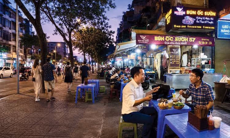 Tỷ trọng cơ sở phi chính thức tại các đô thị lớn có xu hướng giảm. Ảnh: Tiến Giang