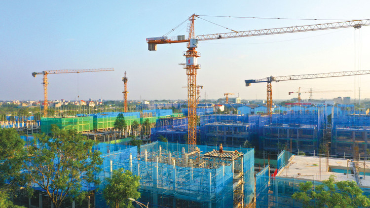 Luật Xây dựng sửa đổi phân định rõ trách nhiệm của các chủ thể tham gia hoạt động xây dựng và hoàn thiện cơ chế quản lý chi phí, hợp đồng xây dựng. Ảnh: Lê Tiên