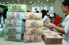 Kế hoạch vay của Chính phủ năm 2022 là 673.546 tỷ đồng, trong đó vay bù đắp bội chi ngân sách trung ương là 450.700 tỷ đồng. Ảnh: Nhã Chi