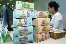 Đến ngày 31/12/2021, nợ xấu chưa xử lý theo Nghị quyết số 42/2017/QH14 vẫn ở mức cao là 412,7 nghìn tỷ đồng. Ảnh: Tiên Giang