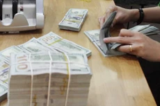 Giá USD tại Vietcombank sáng 24/9 không đổi. Ảnh: Trần Việt/TTXVN.