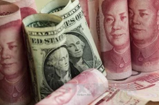 Giá đồng Nhân dân tệ tăng mạnh. Ảnh minh hoạ: AFP/TTXVN