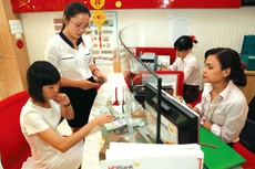 Việc hỗ trợ lãi suất thực hiện trên cơ sở đề nghị của khách hàng và chấp thuận của ngân hàng thương mại tại thời điểm giải ngân khoản vay hoặc ký kết thỏa thuận cho vay. Ảnh: Nhã Chi