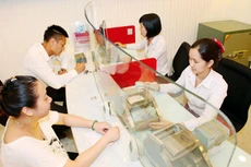 Nhiều ngân hàng công bố lợi nhuận trước thuế 9 tháng đầu năm 2022 tăng trưởng hai con số so với cùng kỳ năm trước. Ảnh: Tường Lâm