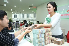 Chính sách của Ngân hàng Nhà nước nhận được sự hưởng ứng của các ngân hàng, mang lại hiệu ứng tích cực cho nền kinh tế. Ảnh: Lê Tiên