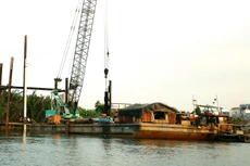 LICOGI 18 là thành viên trong liên danh trúng Gói thầu số 16 thuộc Dự án Nạo vét trục thoát nước rạch Xóm Củi, Quận 8, huyện Bình Chánh và huyện Nhà Bè, TP.HCM. Ảnh: Mhã Chi 