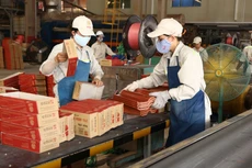 Cần coi việc xử lý kiến nghị của DN là biện pháp mạnh mẽ thúc đẩy quá trình thực thi pháp luật, tạo môi trường kinh doanh thuận lợi cho DN. Ảnh: Lê Tiên