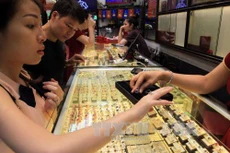 Giá vàng trong nước giảm 250.000 đồng/lượng. Ảnh minh họa: TTXVN