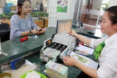 Vietcombank tăng vốn điều lệ lên xấp xỉ 37,1 nghìn tỷ đồng sau khi hoàn tất phát hành cổ phiếu riêng lẻ cho đối tác ngoại. Ảnh: Việt Trần