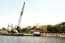 Việc giải ngân đầu tư công phụ thuộc vào nhiều quy định như giải phóng mặt bằng, phê duyệt thiết kế thi công, hồ sơ, thủ tục giải ngân... Ảnh: Lê Tiên