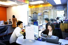 Đến cuối tháng 1/2019, tỷ lệ sử dụng vốn ngắn hạn cho vay trung, dài hạn của các ngân hàng thương mại nhà nước là 31,56%, của các ngân hàng thương mại cổ phần là 32,94%. Ảnh: Lê Tiên