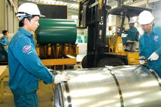 Tác động của việc mở rộng khái niệm doanh nghiệp nhà nước tới hệ thống văn bản pháp luật không lớn. Ảnh: Lê Tiên