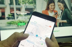 Việc xác định loại hình taxi công nghệ là kinh doanh “vận tải” hay “công nghệ” vẫn chưa ngã ngũ. Ảnh: Tường Lâm