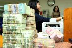 Ngân hàng Nhà nước nêu rõ quan điểm điều hành chính sách tiền tệ thận trọng, linh hoạt nhằm hỗ trợ tăng trưởng kinh tế. Ảnh: Lê Tiên