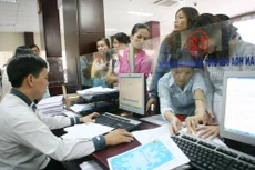Bộ Tài chính đang rà soát, đánh giá tổng kết toàn diện chính sách thuế thu nhập cá nhân để báo cáo Chính phủ trình Ủy ban Thường vụ Quốc hội và Quốc hội xem xét điều chỉnh vào thời điểm thích hợp. Ảnh: Minh Khuê