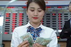 Giá USD bán ra tại ngân hàng thương mại cao nhất đến chiều 28/3 đã ở mức 22.870 VND - Ảnh: Quang Phúc.