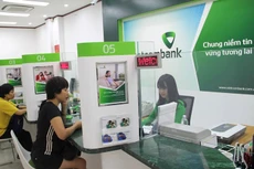 Từ sau năm 2020, các ngân hàng thương mại có thể rút tỷ lệ cổ phần nhà nước xuống còn 51%. Ảnh: Phạm Hương