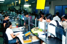 Công tác cải cách hành chính trong lĩnh vực kế hoạch và đầu tư đã góp phần cải thiện môi trường đầu tư, kinh doanh. Ảnh: Lê Tiên