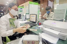 Vietcombank cam kết từ 1/1 đến hết 30/4/2023 giảm 0,5%/năm lãi suất cho tất cả khách hàng có dư nợ hiện hữu và phát sinh mới tại ngân hàng. Ảnh chỉ mang tính minh họa. Nguồn Internet