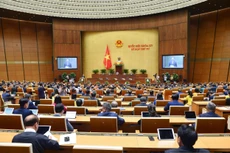 Chủ nhiệm Ủy ban Quốc phòng và An ninh của Quốc hội Lê Tấn Tới trình bày Báo cáo giải trình, tiếp thu, chỉnh lý dự thảo Nghị quyết về thí điểm đấu giá biển số xe ô tô.