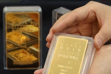 Giá vàng thế giới thiết lập kỷ lục mới trong phiên 27/7. Ảnh: TTXVN phát