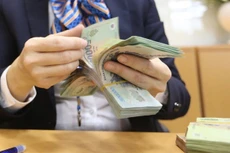 Tiền nhiều, lãi suất liên ngân hàng lình xình thấp
