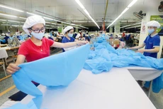 Hỗ trợ doanh nghiệp nhằm tháo gỡ khó khăn, vượt qua Covid-19 được coi là giải pháp quan trọng, động lực cho nền kinh tế trong giai đoạn tới. Ảnh: Việt Trần