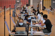 Singapore: Người chưa tiêm vaccine phải xét nghiệm 2 lần mỗi tuần