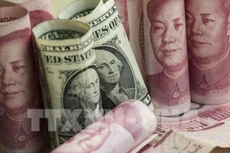 Giá đồng Nhân dân tệ tăng mạnh. Ảnh: TTXVN phát