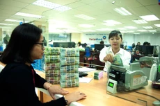 Nhiều ngân hàng thương mại cổ phần do Nhà nước nắm giữ trên 50% vốn điều lệ đã có phương án tăng vốn năm 2021. Ảnh: Thành An