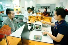 Việc điều hành lãi suất cần hài hòa lợi ích của người gửi tiền - người vay tiền và bảo đảm ổn định kinh tế vĩ mô. Ảnh: Lê Tiên