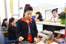 Doanh nghiệp rất mong được hỗ trợ thực chất từ chủ trương giảm lãi suất cho vay. Ảnh: Song Lê